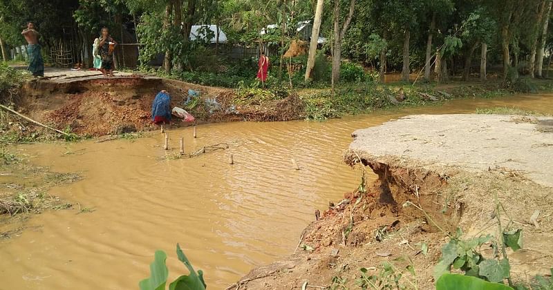 Flash flood damages an embankment and submerges new areas in Sherpur