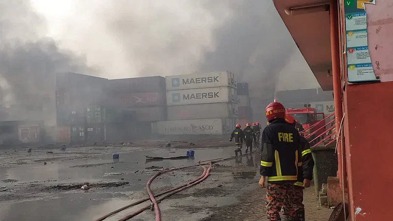 Fire Service members try to douse the fire