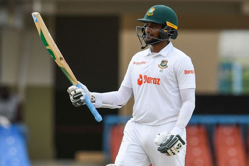 Shakib Al Hasan, of Bangladesh, celebrates his half century during the third day of the 1st Test between Bangladesh and West Indies at Vivian Richards Cricket Stadium in North Sound, Antigua and Barbuda, on 18 June, 2022