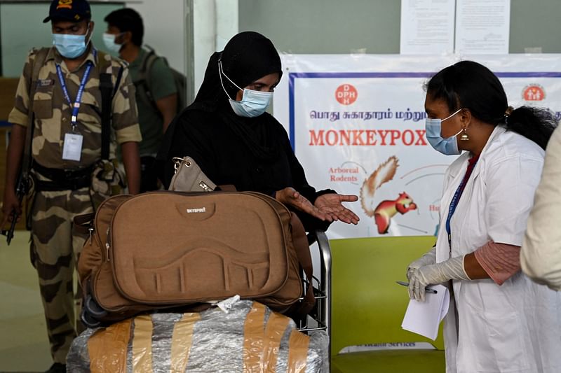 Health workers screen passengers arriving from abroad for Monkeypox symptoms at Anna International Airport terminal in Chennai on 3 June, 2022