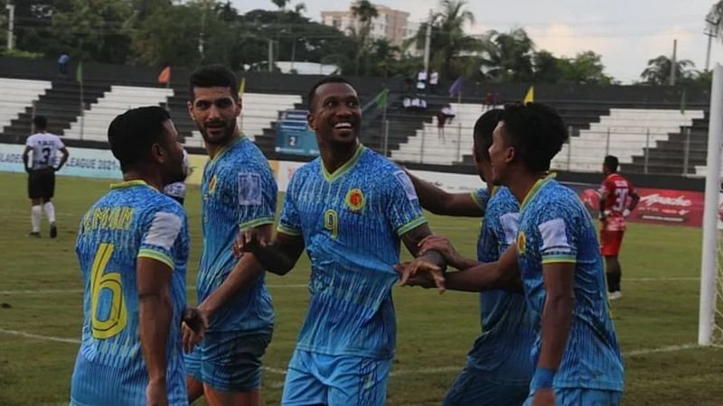 Dhaka Abahani’s Brazilian forward Dorielton celebrates with teammates after scoring a goal during a BPL football match against arch-rival Mohammedan Sporting Club Limited at the Shaheed Dhirendranath Datta Stadium in Cumilla on 22 June, 2022