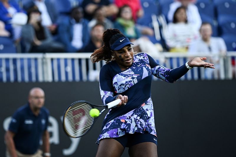 Serena Williams playing with Tunisia's Ons Jabeur, returns the ball to Japan's Shuko Aoyama and Tawain's Chan Hao-ching during their women's doubles quarter final tennis match on day four of the Eastbourne International tennis tournament in Eastbourne, southern England on 22 June, 2022