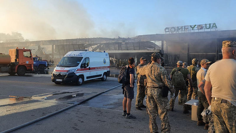 This handout picture taken and released by the Ukraine's State Emergency Service on 27 June, 2022 shows rescuers working in a mall hit by a Russian missile strike in the eastern Ukrainian city of Kremenchuk