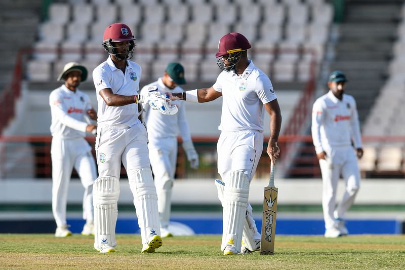 Kraigg Brathwaite (L) and John Campbell (R) of West Indies walking off the field at the end of the 1st day of the 2nd Test between Bangladesh and West Indies at Darren Sammy Cricket Ground, Gros Islet, Saint Lucia, on 24 June 2022