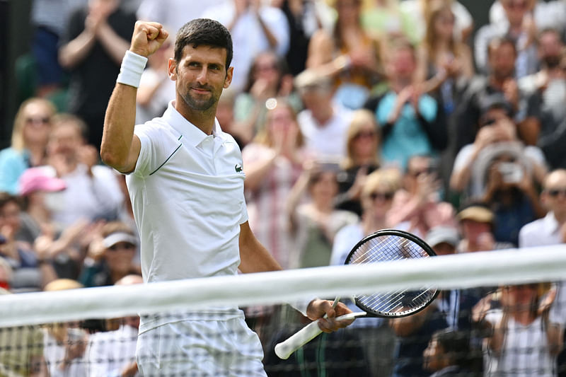 Serbia's Novak Djokovic celebrates beating Australia's Thanasi Kokkinakis during their men's singles tennis match on the third day of the 2022 Wimbledon Championships at The All England Tennis Club in Wimbledon, southwest London, on 29 June, 2022