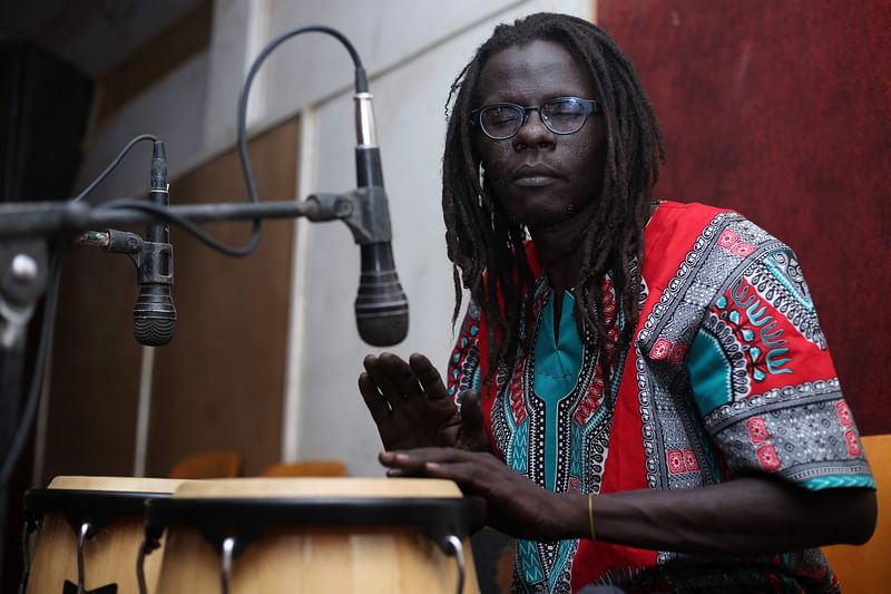 A musician plays the conga during rehearsals at a studio in Omdurman, the capital Khartoum's twin city, on 18 May, 2022