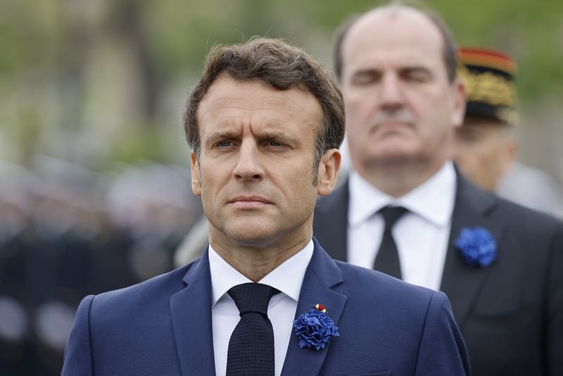 France's President Emmanuel Macron reacts at the Arc de Triomphe as part of the ceremonies marking the Allied victory against Nazi Germany and the end of World War II in Europe (VE Day), in Paris, France, on 8 May 2022