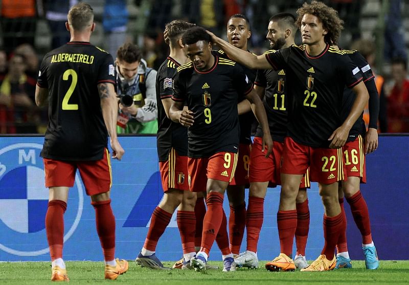 Belgium's forward Lois Openda (C) celebrates with teammates after scoring his team's sixth goal during the UEFA Nations League - League A - Group 4 football match between Belgium and Poland at The King Baudouin Stadium in Brussels, on 8 June, 2022