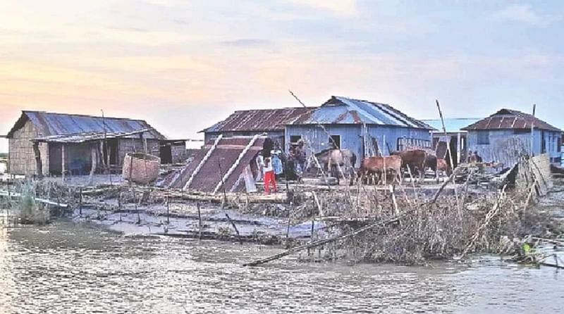 People renovating their houses at Char Rajibpur after the flood water receded on 25 June, 2022