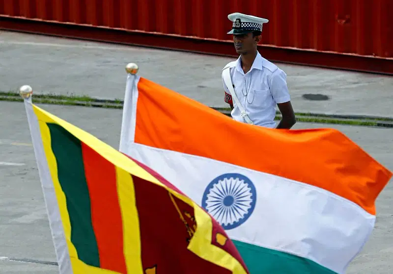 A Navy officer stands in front of India's and Sri Lanka's national flags as Indian Coast Guard Ship (ICGS) Shoor is in the Colombo port during its visit in Colombo, Sri Lanka on 
 2 April, 2018.