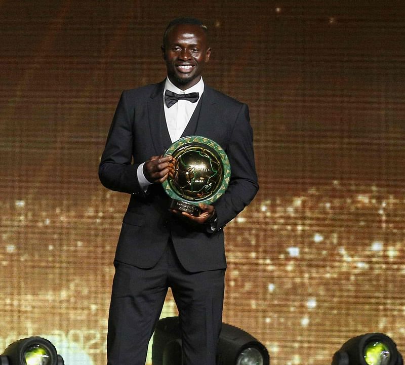 Senegalese forward Sadio Mane poses with the trophy after winning the Men's Player of the Year during the 2022 Confederation of African Football (CAF) Awards on 21 July, 2022, in the Moroccan capital Rabat