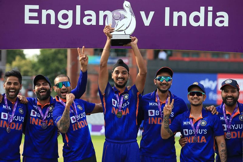 India's Arshdeep Singh poses with the trophy during the winners presentation after the final one-day international (ODI) cricket match between England and India at Old Trafford in Manchester on 17 July, 2022