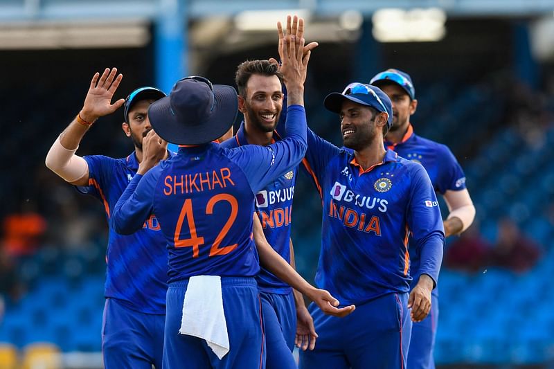 Prasidh Krishna (2L) and Suryakumar Yadav (R), of India, celebrate the dismissal of Nicholas Pooran, of West Indies, during the third and final ODI match between West Indies and India at Queens Park Oval in Port of Spain, Trinidad and Tobago, on 27 July, 2022