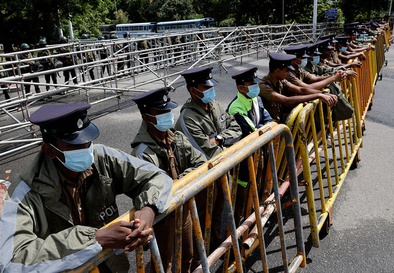 Security personnel stand guard outside the parliament building, amid the country's economic crisis, in Colombo, Sri Lanka.