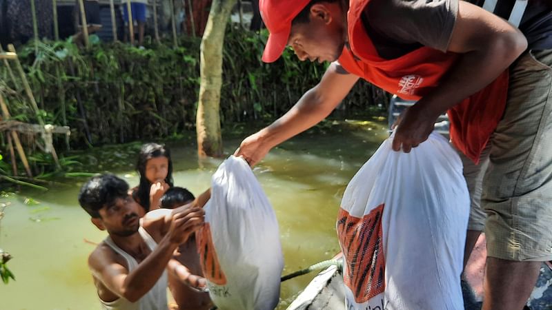 Relief materials are being handed over to the flood-victims.