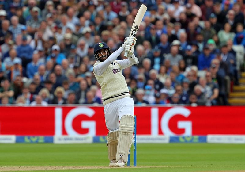 India's Jasprit Bumrah watches the ball after playing a shot to break 400 runs on Day 2 of the fifth cricket Test match between England and India at Edgbaston, Birmingham in central England on 2 July, 2022