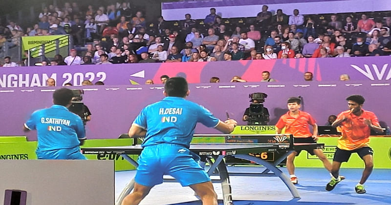 Bangladesh and India competing in the men's table tennis quarterfinal in Birmingham, England on Sunday.