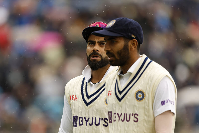 Jasprit Bumrah walk off the field as rain delays play during the fifth Test between India and England at Edgbaston, Brisbane, England