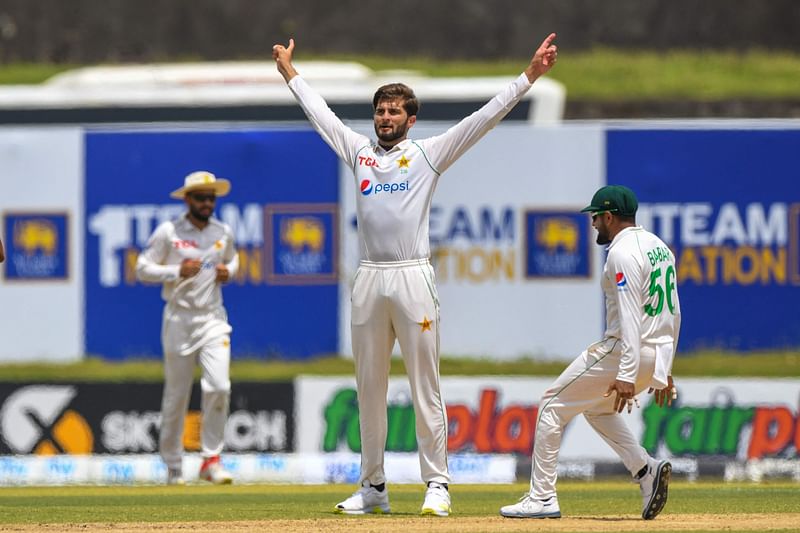 Pakistan’s Shaheen Shah Afridi (C) celebrates after taking the wicket of Sri Lanka's Dhananjaya de Silva (not pictured) during the first day of the first Test match between Sri Lanka and Pakistan at the Galle International Cricket Stadium in Galle on 16 July, 2022