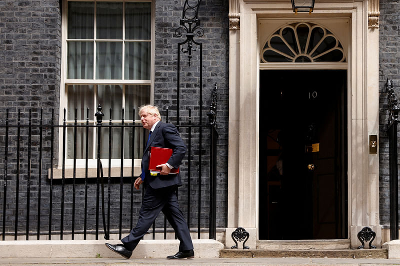 British Prime Minister Boris Johnson walks at Downing Street, in London, Britain, 6 July 2022