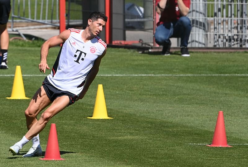 Bayern Munich's Polish forward Robert Lewandowski warms up during a training session of German first division Bundesliga football team FC Bayern Munich at the club's area in Munich, southern Germany, on 14 July, 2022