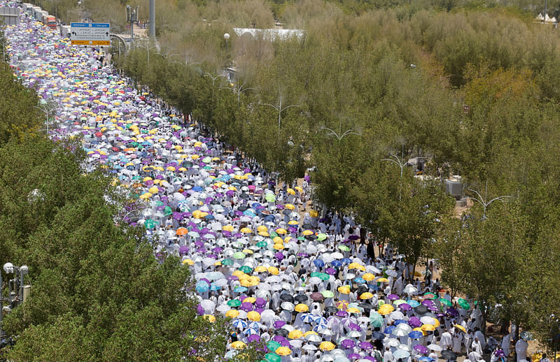 Muslim pilgrims gather on the plain of Arafat during the annual Hajj pilgrimage, outside the holy city of Mecca, Saudi Arabia, 8 July 2022