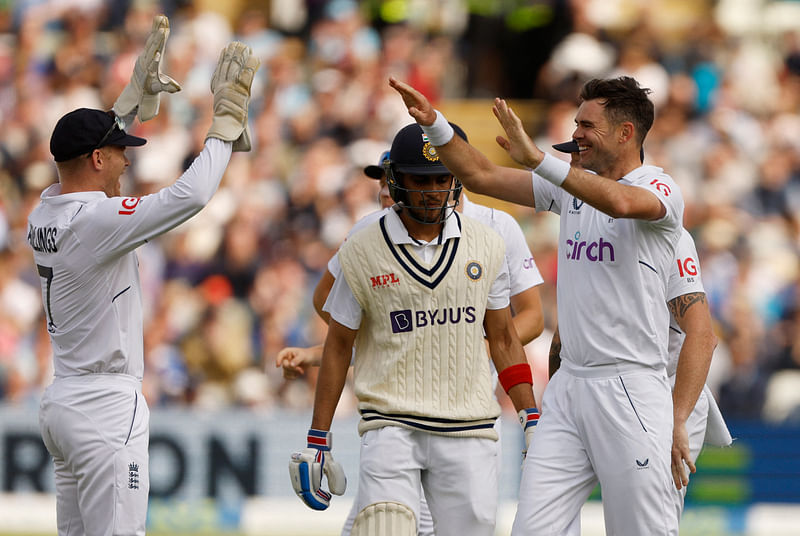 England's James Anderson celebrates with Sam Billings after taking the wicket of India's Shubman Gill on the first day of the Edgbaston Test on 1 July, 2022