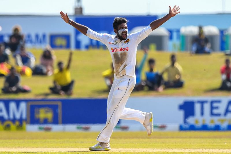 Sri Lanka's Ramesh Mendis celebrates after taking the wicket of Pakistan's Fawad Alam (not pictured) during the second day of the second cricket Test match between Sri Lanka and Pakistan at the Galle International Cricket Stadium in Galle on 25 July, 2022