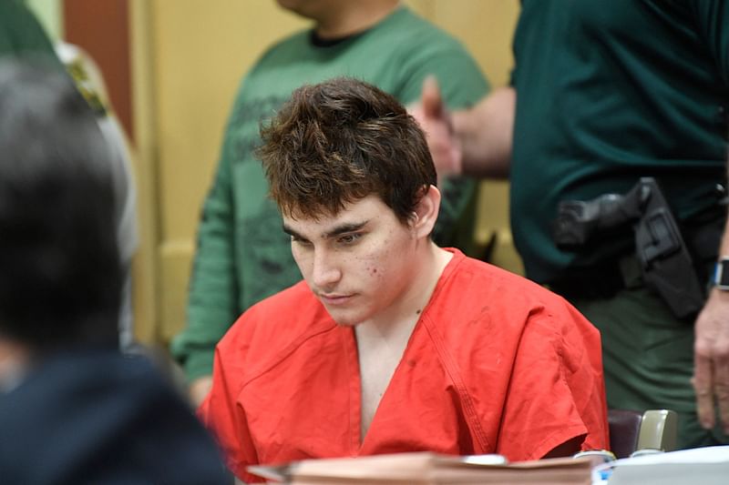 In this file photo taken on 27 April, 2018, Florida school shooting suspect Nikolas Cruz looks down during a hearing in Fort Lauderdale, Florida