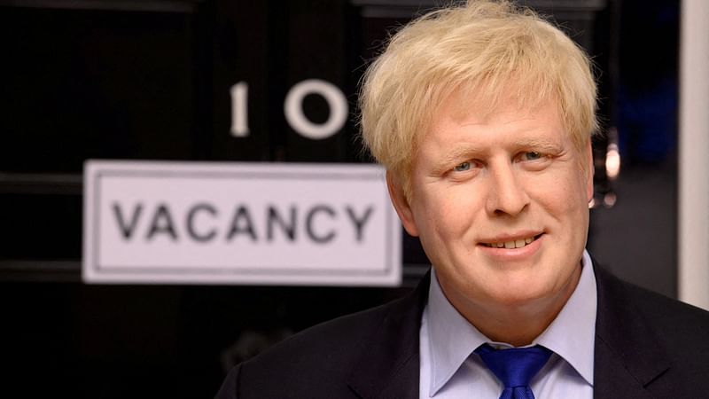 A wax figure of Boris Johnson is pictured next to a 'vacancy' sign on 10 Downing Street at Madame Tussauds, in London, Britain on 7 July 2022