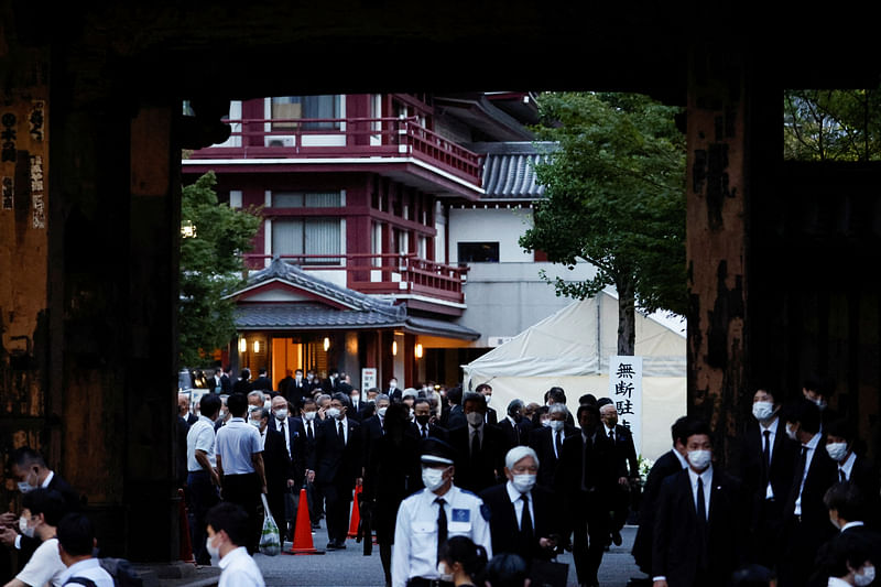 Officials and mourners attend the vigil for late former Japanese Prime Minister Shinzo Abe, who was shot while campaigning for a parliamentary election, at Zojoji Temple, in Tokyo, Japan 11 July, 2022