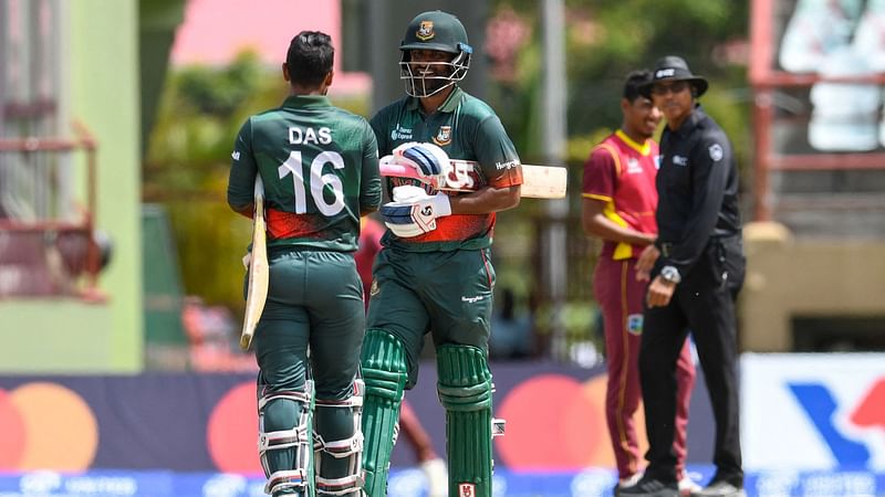 Tamim Iqbal (2L) of Bangladesh celebrates winning on during the 2nd ODI match between West Indies and Bangladesh at Guyana National Stadium in Providence, Guyana, on 13 July, 2022