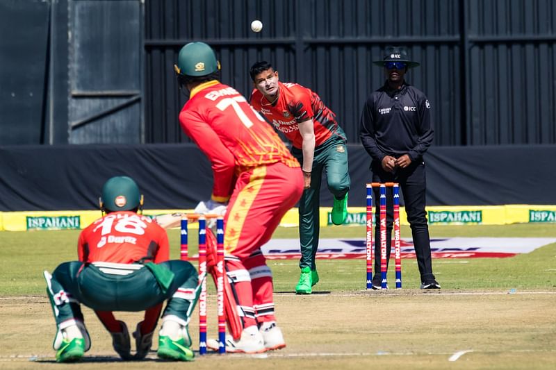 Bangladesh bowler Nasum Ahmed (2nd R) delivers during the first T20i cricket match played between Bangladesh and hosts Zimbabwe, on 30 July 2022 at the Harare Sports Club