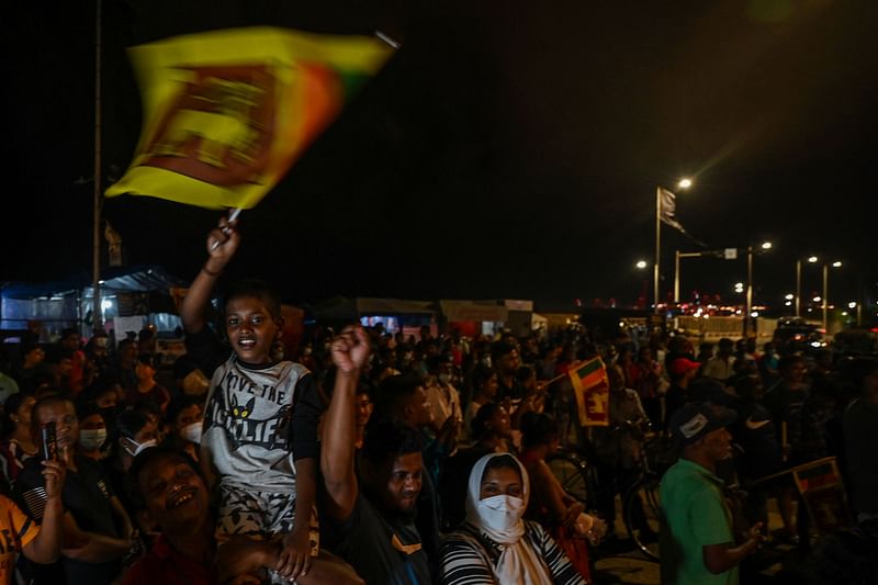 Demonstrators take part in a celebration as Sri Lanka's protest movement reached its 100th day at the Galle face protest area near Presidential secretariat in Colombo on July 17, 2022