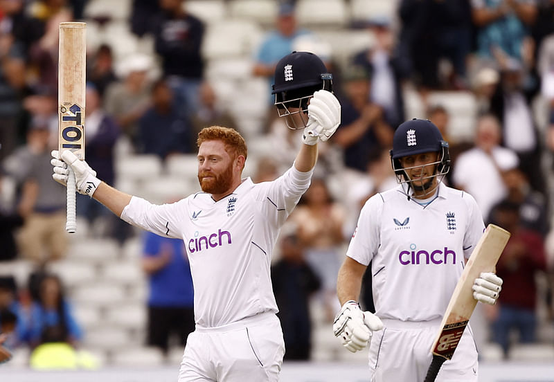 England's Jonny Bairstow celebrates reaching his century with Joe Root on Day five of the Edgbaston Test against India on 5 July, 2022