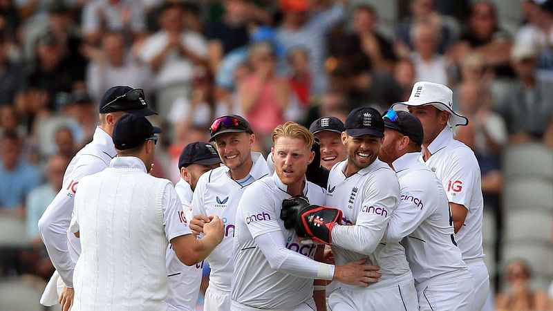 England's captain Ben Stokes (C) celebrates the dismissal of South Africa's Rassie van der Dussen on day 3 of the second Test match between England and South Africa at the Old Trafford cricket ground in Manchester, north-west England on 27 August, 2022