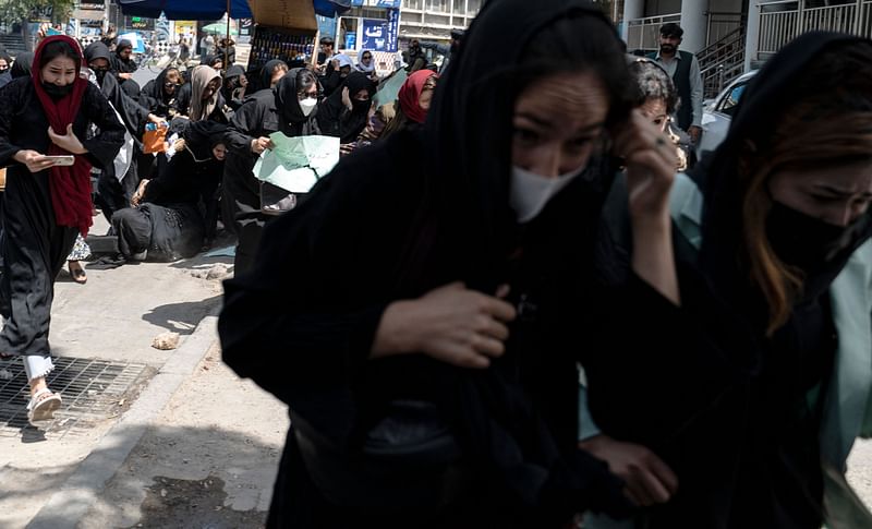 Taliban fighters fire in air to disperse Afghan women protesters in Kabul on 13 August, 2022