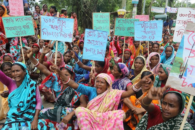 Tea workers observe a two-hour long strike to press home several demands, including the increase of daily wage. The picture was taken from Lakkatura in Sylhet on 10 August.