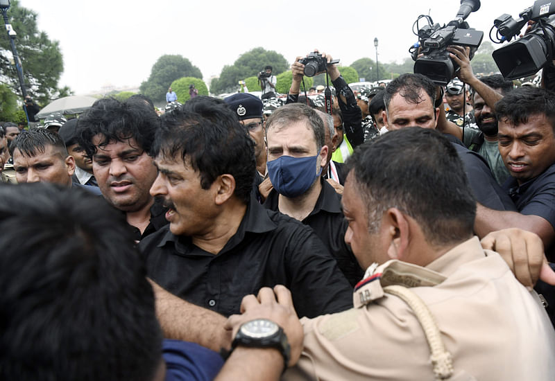 Congress leader Rahul Gandhi being detained during the nationwide protest against unemployment and inflation, at Vijay Chowk, in New Delhi on Friday.