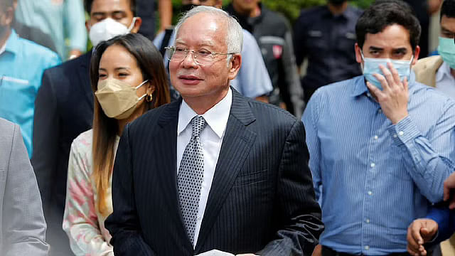 Former Malaysian prime minister Najib Razak walks out from the Federal Court during a court break, in Putrajaya, Malaysia on 23 August.