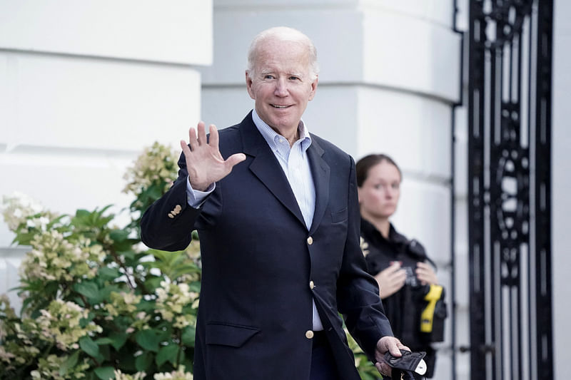 US president Joe Biden waves to the media as he walks towards Marine One for departure to Rehoboth Beach, Delaware from the South Lawn of the White House in Washington, DC, US on 7 August, 2022.