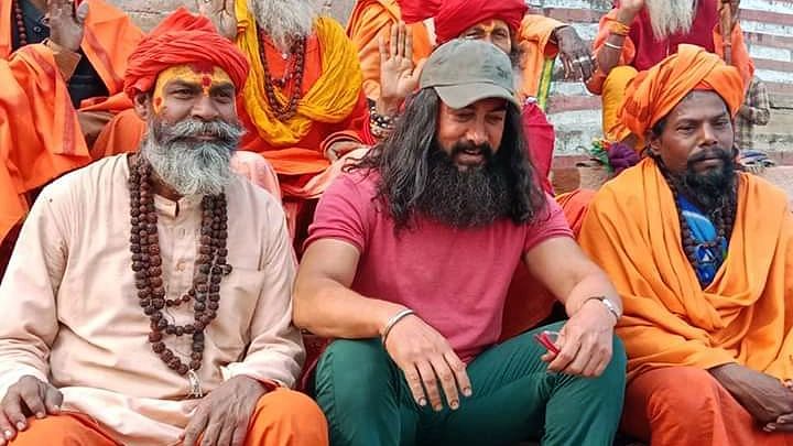 Bollywood actor Amir Khan sits with sadhus during the shooting of his upcoming movie' Laal Singh Chaddha' in Varanasi on 10 December 2019