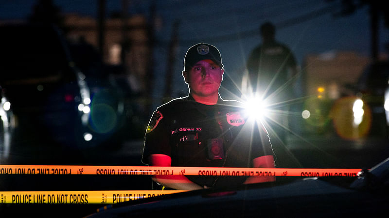 New Jersey police officers stand guard near the building where alleged attacker of Salman Rushdie, Hadi Matar, lives in Fairview, New Jersey