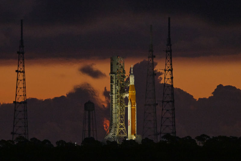 NASA's next-generation moon rocket, the Space Launch System (SLS) , with its Orion crew capsule on top, sits on the pad early in the morning before the unmanned Artemis 1 mission was scrubbed, at Cape Canaveral, Florida, US, 29 August, 2022