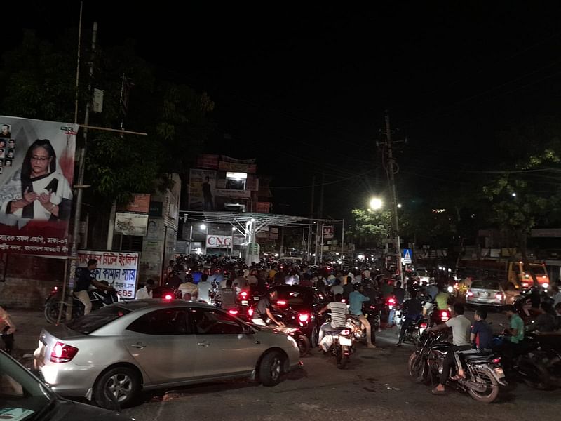 Bikers throng a filling station at Nilkhet intersection in the capital on Friday night hours after the government hiked fuel oil price by a big margin.