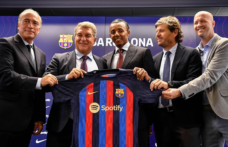 FC Barcelona's vice president Rafael Yuste, Barcelona's Spanish President Joan Laporta, FC Barcelona's new french defender Jules Kounde, FC Barcelona's sports director Mateu Alemany and Barcelona's Spanish sporting advisor Jordi Cruyff pose for pictures during a press conference as part of Kounde's presentation ceremony at the Joan Gamper training ground in Sant Joan Despi, near Barcelona, on 1 August, 2022