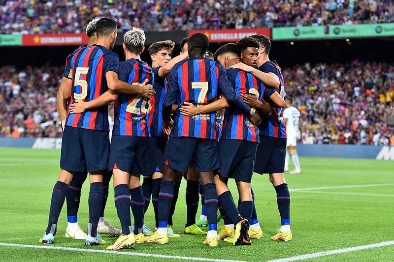 Barcelona's Spanish midfielder Pedri (C) celebrates with teammates after scoring a goal during the 57th Joan Gamper Trophy friendly football match between FC Barcelona and Club Universidad Nacional Pumas at the Camp Nou stadium in Barcelona on 7 August, 2022