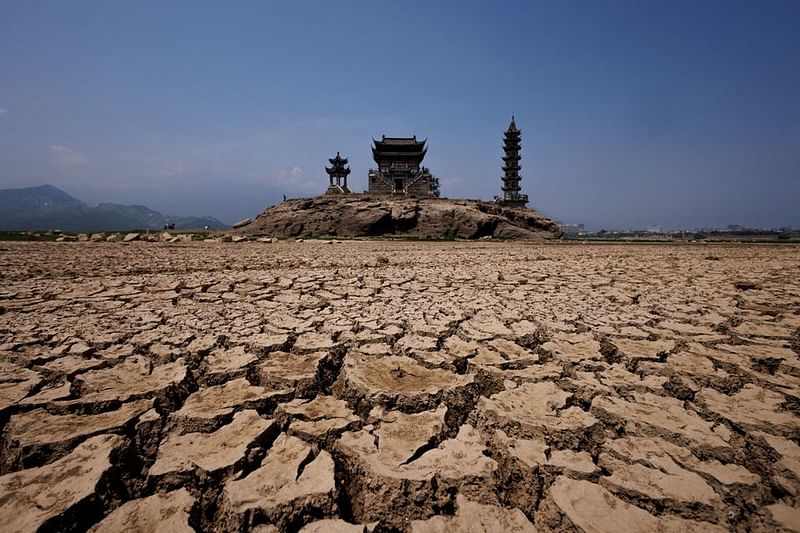 A view of pagodas on Louxingdun island that usually remain partially submerged under the water of Poyang Lake which is facing low water levels due to a regional drought in Lushan, Jiangxi province, China, 24 August, 2022.