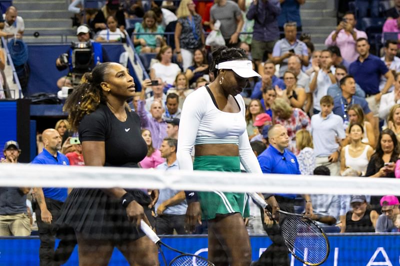 USA's Serena Williams (L) and Venus Williams leave the court after their loss against Czech Republic's Lucie Hradecka and Linda Noskova during their 2022 US Open Tennis tournament women's doubles first round match at the USTA Billie Jean King National Tennis Center in New York, on 1 September, 2022