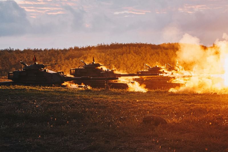 In this file handout photo courtesy of Taiwan’s Ministry of National Defence taken on 24 August, 2022 US-made M60-A3 tanks fire during a drill at Penghu islands